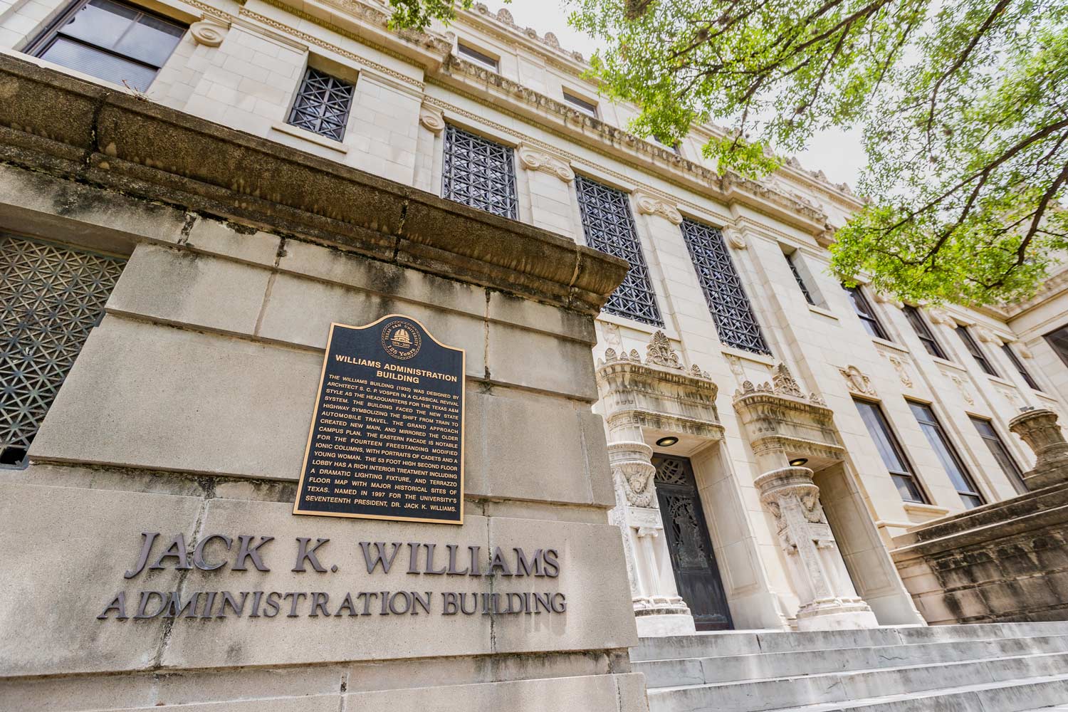 Looking up at the Jack K Williams Administration building historical marker