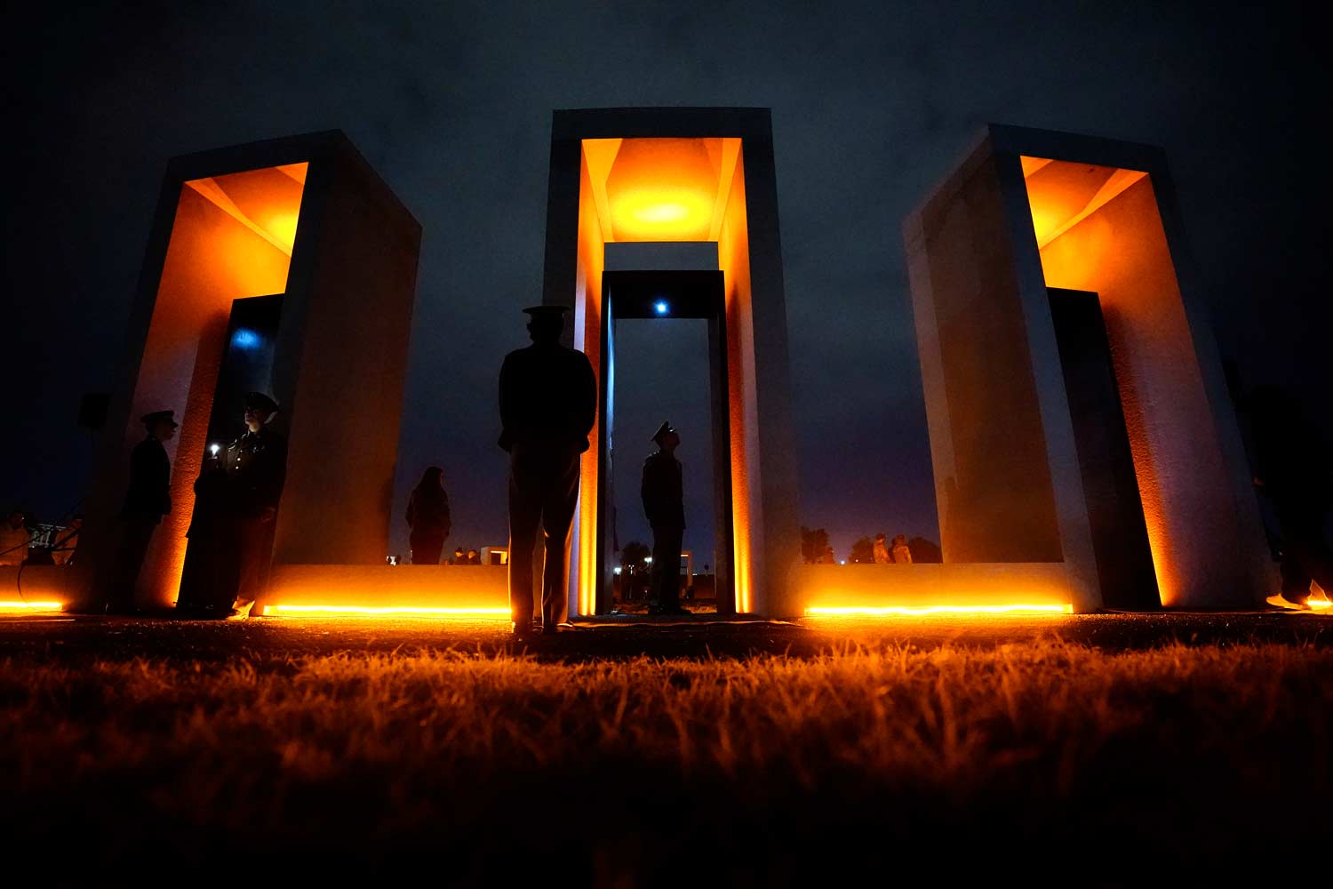 One of the bonfire memorial pillars lit up on the night of remembrance