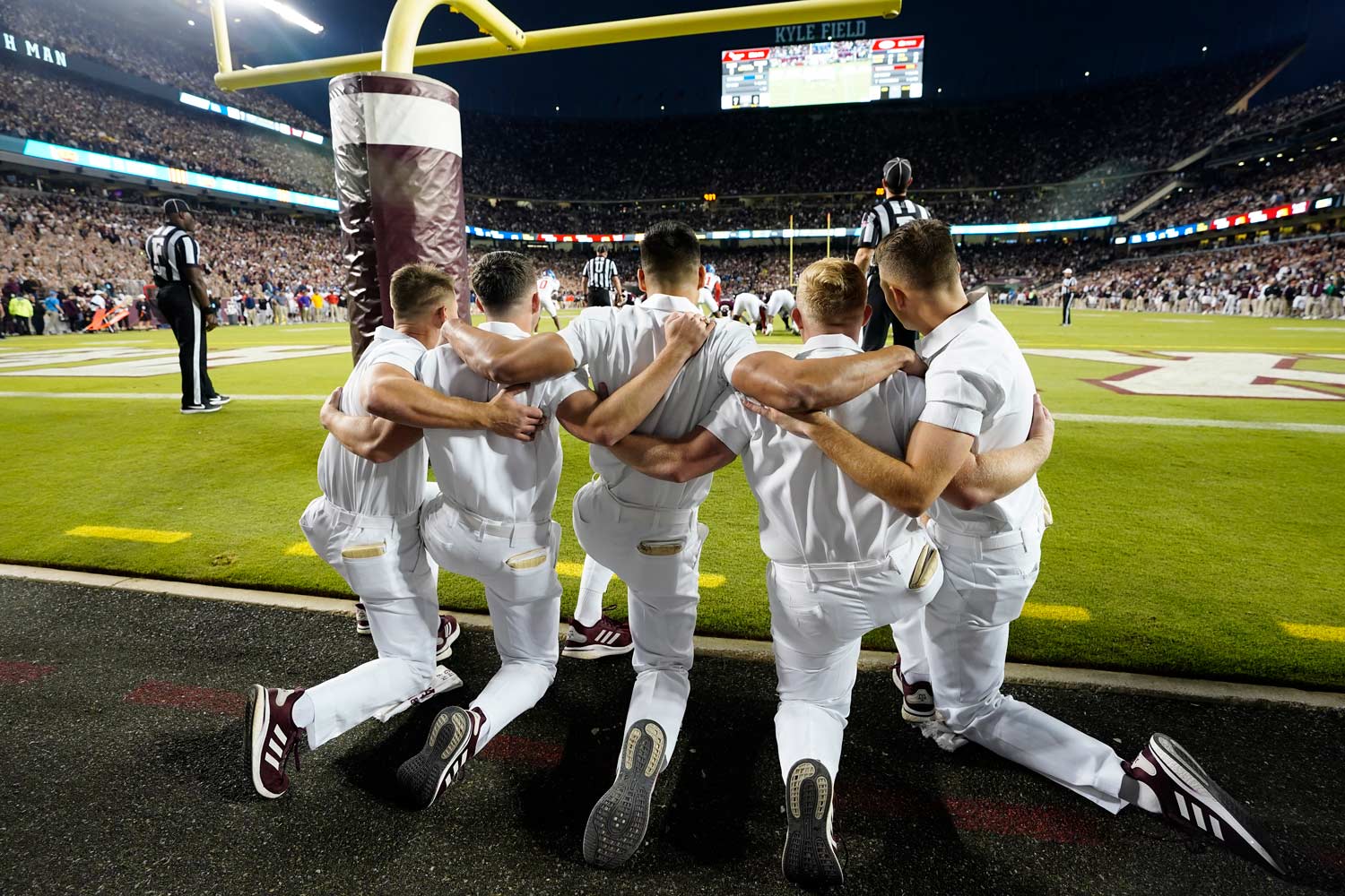 The Texas A&M Yell leaders prep for kickoff in the endzone of Kyle Field